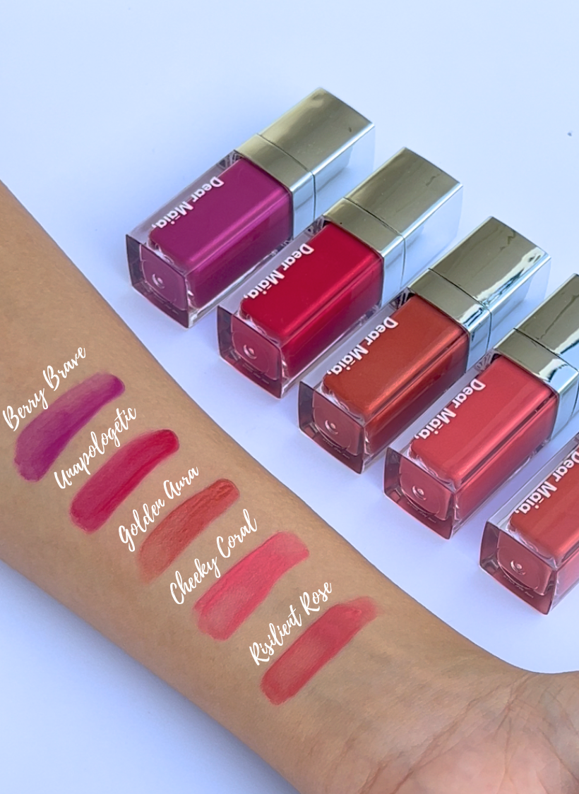 Set of luminous liquid blush with swatches on a arm against a light blue background