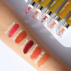 Dear Māia Lip Treatment displayed on a hand with swatches, set against a white background.
