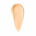 Beige concealer swatch on a white background